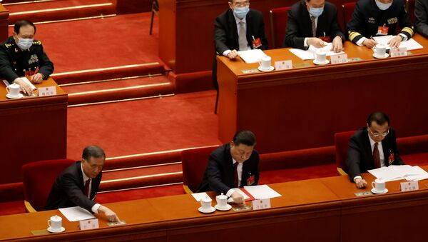 Chinese President Xi Jinping and other leaders cast their votes on Hong Kong electoral reform at the closing session of the National People's Congress (NPC) at the Great Hall of the People in Beijing, China March 11, 2021 - Sputnik International