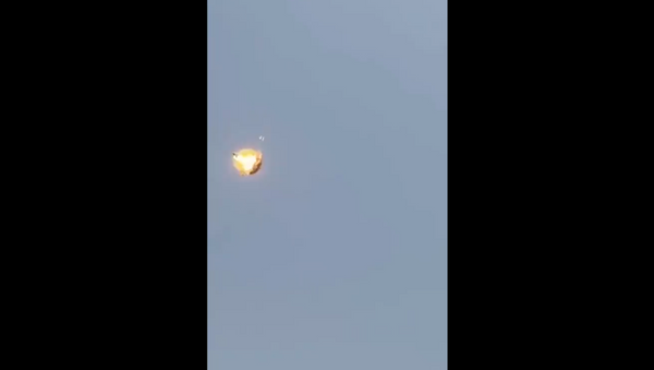 Screenshot captures the moment that a Saudi F-15 jet intercepts a drone launched by Houthi rebels. - Sputnik International