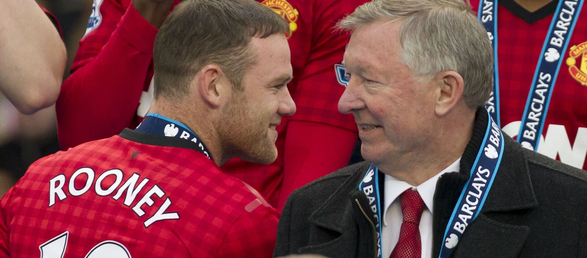 Manchester United's manager Sir Alex Ferguson, right, speaks to striker Wayne Rooney after his last home game in charge of the club, their English Premier League soccer match against Swansea, at Old Trafford Stadium, Manchester, England, Sunday May 12, 2013 - Sputnik International, 1920, 01.04.2021