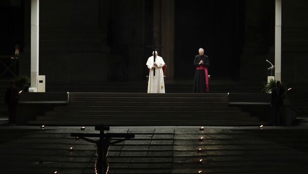 Pope Francis presides over the Via Crucis – or Way of the Cross – ceremony in St Peter's Square devoid of tourists and the faithful, who would normally be flocking to the spot, because of Italy's ban on gatherings to prevent the spread of coronavirus, at the Vatican, Friday, 10 April 2020. - Sputnik International
