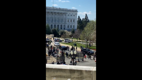 Screenshot shows multiple officers converging at the North Barricade entrance of the US Capitol after an unidentified individual rammed their vehicle past security barriers. - Sputnik International