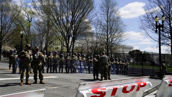 National Guard members stand guard near the U.S. Capitol following a security threat at the U.S. Capitol in Washington, D.C., U.S.  April 2, 2021. - Sputnik International