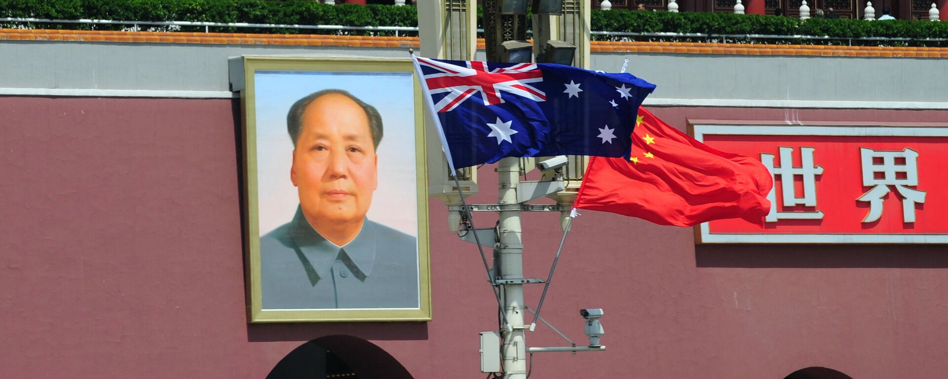 The national flags of Australia and China are displayed before a portrait of Mao Zedong facing Tiananmen Square, during a visit by Australia's Prime Minister Julia Gillard in Beijing on April 26, 2011.  AFP PHOTO/Frederic J. BROWN (Photo by FREDERIC J. BROWN / AFP) - Sputnik International, 1920, 26.11.2021