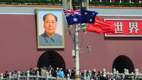 The national flags of Australia and China are displayed before a portrait of Mao Zedong facing Tiananmen Square, during a visit by Australia's Prime Minister Julia Gillard in Beijing on April 26, 2011.  AFP PHOTO/Frederic J. BROWN (Photo by FREDERIC J. BROWN / AFP) - Sputnik International