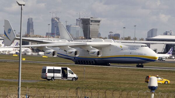 The world's largest cargo plane, the Soviet-made Antonov An-225 Mrija, lands in Warsaw's Frederic Chopin airport with a $15 million worth cargo of protective masks, outfits and visors that were bought by Poland's state-owned companies for hospitals fighting the coronavirus spread, in Warsaw, Poland, Tuesday, April 14, 2020. - Sputnik International