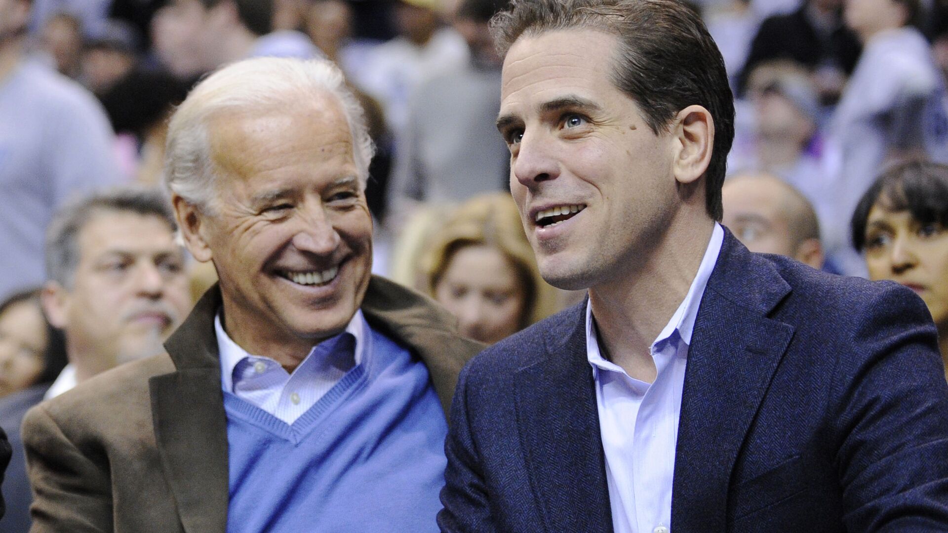 Then Vice President Joe Biden, left, and his son Hunter Biden appear at the Duke Georgetown NCAA college basketball game in Washington on Jan. 30, 2010. - Sputnik International, 1920, 31.01.2022