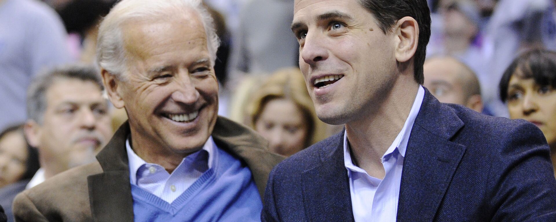 Then Vice President Joe Biden, left, and his son Hunter Biden appear at the Duke Georgetown NCAA college basketball game in Washington on Jan. 30, 2010. - Sputnik International, 1920, 28.05.2021