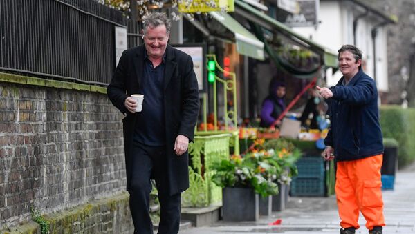 A passerby gestures to journalist and television presenter Piers Morgan, after he left his high-profile breakfast slot with the broadcaster ITV, following his long-running criticism of Prince Harry's wife Meghan, in London, Britain, 10 March 2021 - Sputnik International