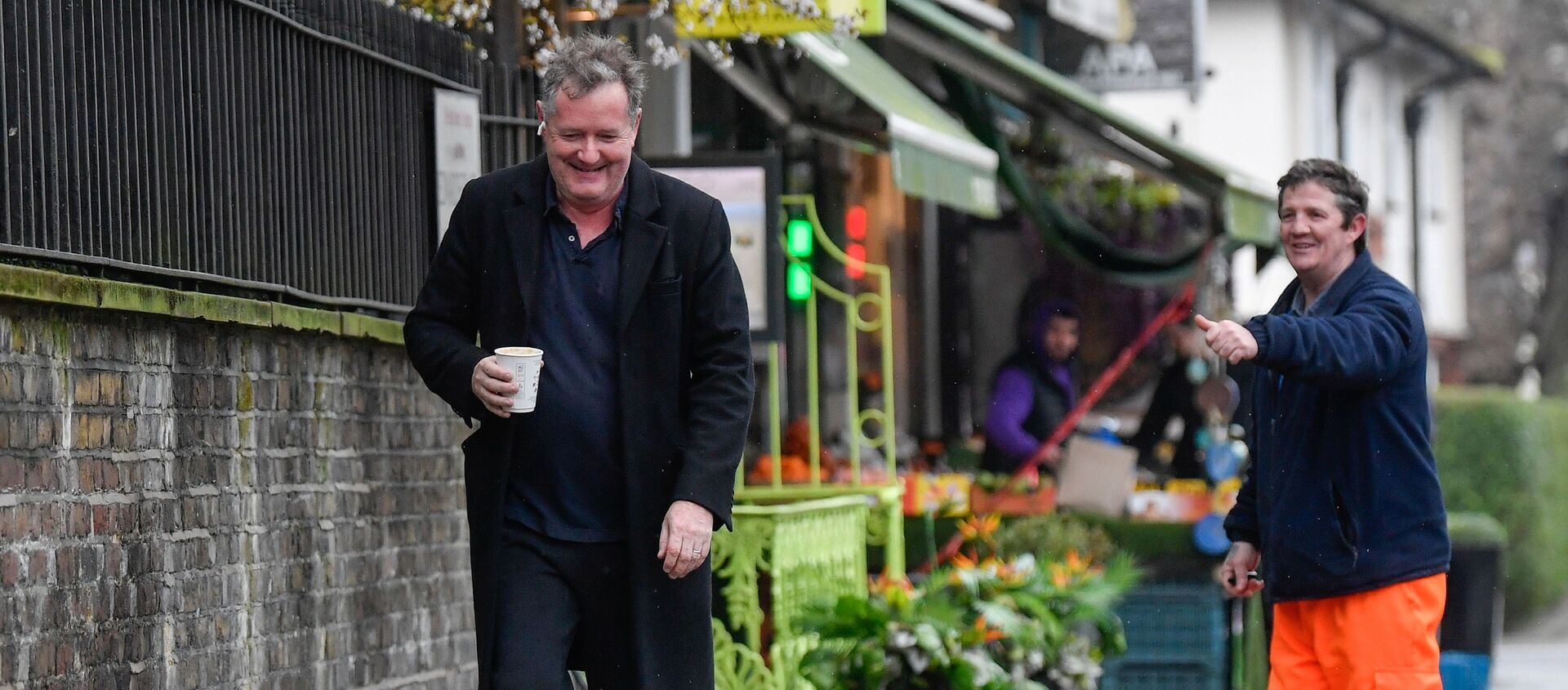 A passerby gestures to journalist and television presenter Piers Morgan, after he left his high-profile breakfast slot with the broadcaster ITV, following his long-running criticism of Prince Harry's wife Meghan, in London, Britain, 10 March 2021 - Sputnik International, 1920, 06.04.2021