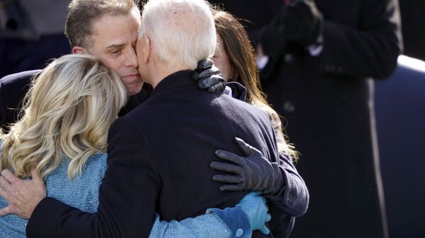 President Joe Biden hugs first lady Jill Biden, his son Hunter Biden and daughter Ashley Biden after being sworn-in during the 59th Presidential Inauguration at the US Capitol in Washington, 20 January 2021 - Sputnik International