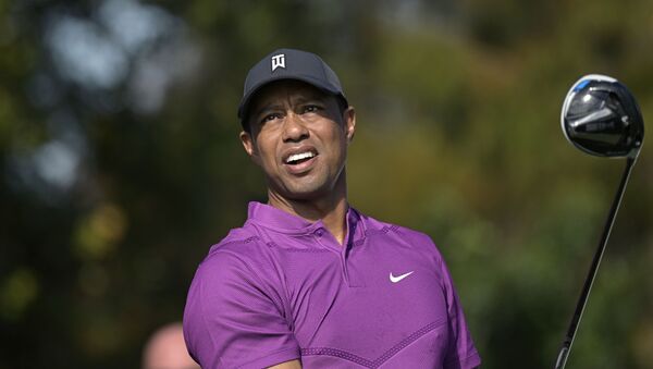 Tiger Woods watches his tee shot on the first hole during the first round of the PNC Championship golf tournament, Saturday, Dec. 19, 2020, in Orlando, Fla. - Sputnik International