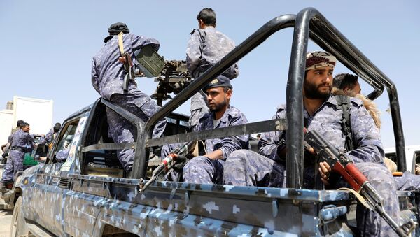 Police troopers ride on the back of a patrol truck following a funeral of Houthi fighters killed during recent fighting against government forces at different fronts, in Sanaa, Yemen March 23, 2021 - Sputnik International