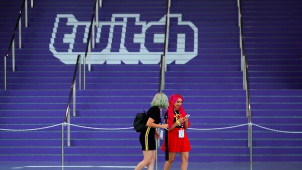 FILE PHOTO: Attendees walk past a Twitch logo painted on stairs during opening day of E3, the annual video games expo revealing the latest in gaming software and hardware in Los Angeles, California, U.S., June 11, 2019.  REUTERS/Mike Blake/File Photo - Sputnik International