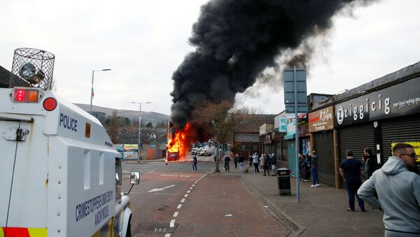 A hijacked bus burns on The Shankill Road as protests continue in Belfast, Northern Ireland, April 7, 2021 - Sputnik International