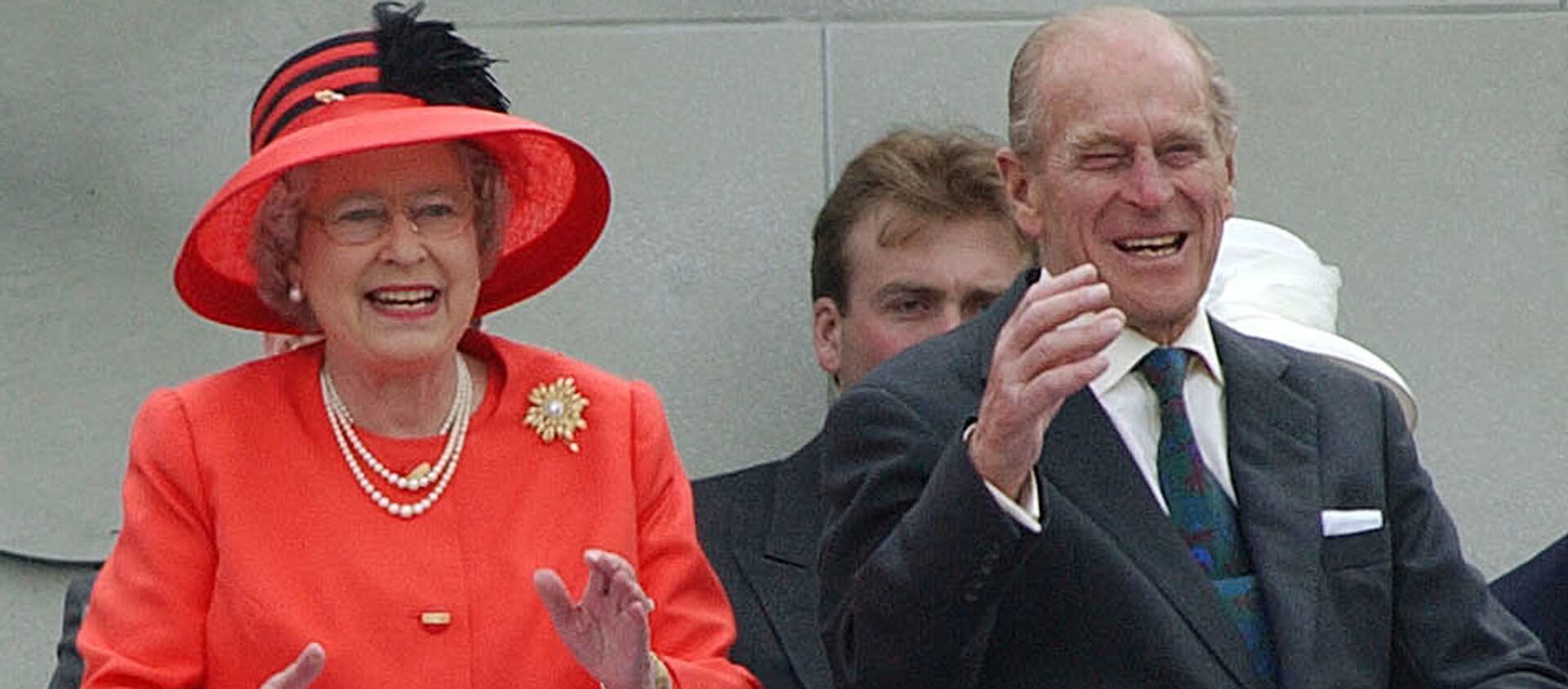 Britain's Queen Elizabeth II laughs with her husband, Prince Philip, as they watch a parade in The Mall in London Tuesday, June 4, 2002, as part of the Golden Jubilee celebrations.  - Sputnik International, 1920, 09.04.2021