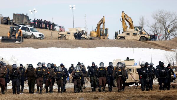 FILE PHOTO: Law enforcement officers advance into the main opposition camp against the Dakota Access oil pipeline near Cannon Ball, North Dakota, U.S., February 23, 2017. - Sputnik International