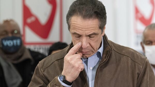 New York Gov. Andrew Cuomo touches his nose during a visit to a new COVID-19 vaccination site, Monday, 15 March 2021, at the State University of New York in Old Westbury. The site is scheduled to open on Friday.  - Sputnik International