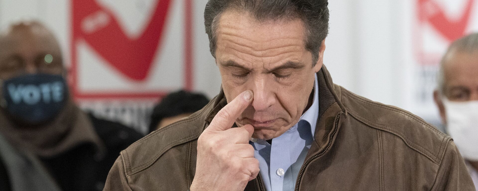 New York Gov. Andrew Cuomo touches his nose during a visit to a new COVID-19 vaccination site, Monday, March 15, 2021, at the State University of New York in Old Westbury. The site is scheduled to open on Friday.  - Sputnik International, 1920, 22.11.2021