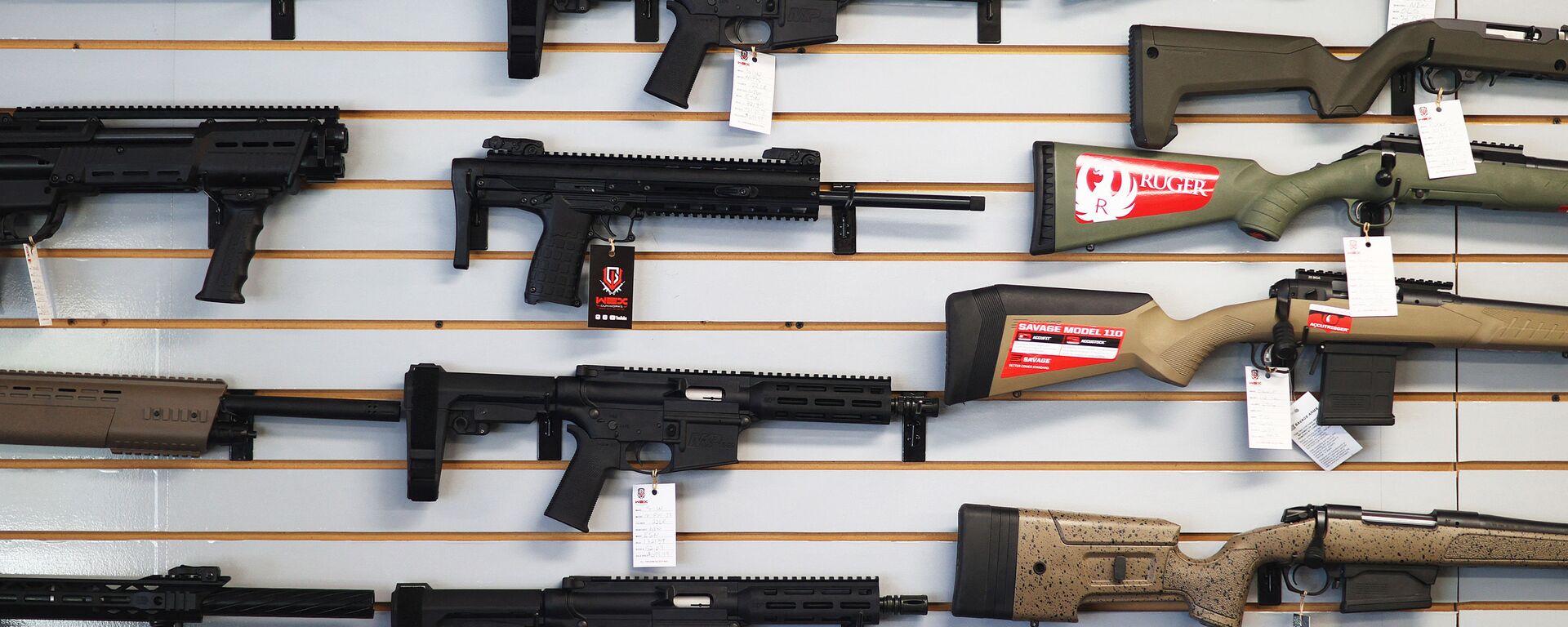 DELRAY BEACH, FLORIDA - MARCH 24: Weapons for sale hang on the wall at WEX Gunworks on March 24, 2021 in Delray Beach, Florida. U.S. President Joe Biden has called on lawmakers to “immediately pass” legislation to help curb gun violence in the county.   - Sputnik International, 1920, 09.10.2023