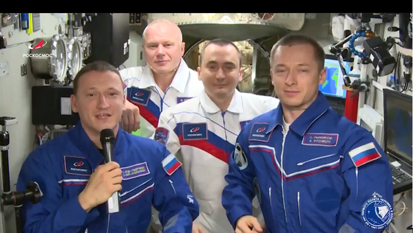 A screen shot from footage of Russian cosmonauts congratulating everyone with the 60th anniversary of Yuri Gagarin's historic space flight  - Sputnik International