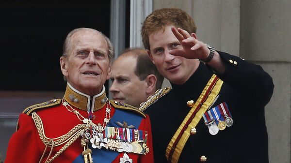 In this June 14, 2014 file photo, Britain's Prince Harry talks to Prince Philip as members of the Royal family appear on the balcony of Buckingham Palace, during the Trooping The Colour parade, in central London - Sputnik International