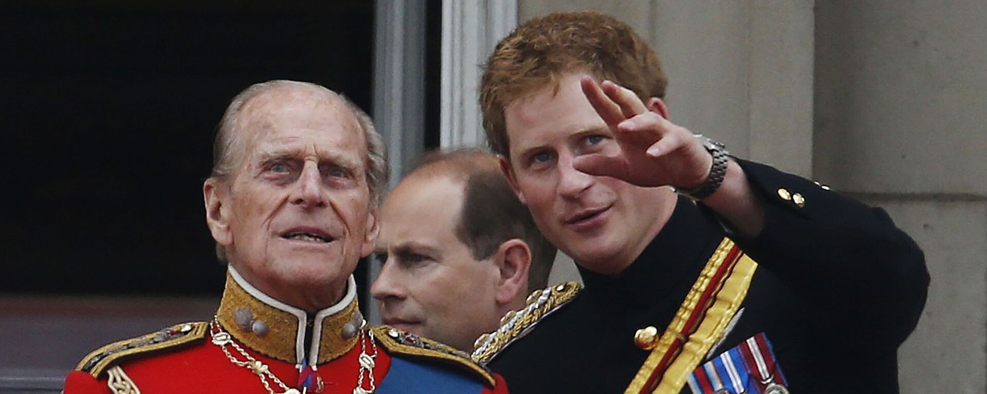 In this 14 June 2014 file photo, Britain's Prince Harry talks to Prince Philip as members of the Royal family appear on the balcony of Buckingham Palace, during the Trooping The Colour parade, in central London - Sputnik International, 1920, 12.04.2021