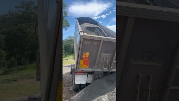 Tip Truck Trailer Topples Over While Unloading || ViralHog - Sputnik International