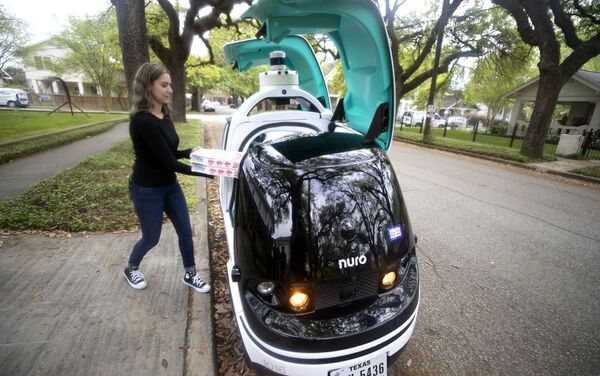 An undated handout photo of Nuro autonomous car delivering Domino's Pizza order in Houston Texas - Sputnik International