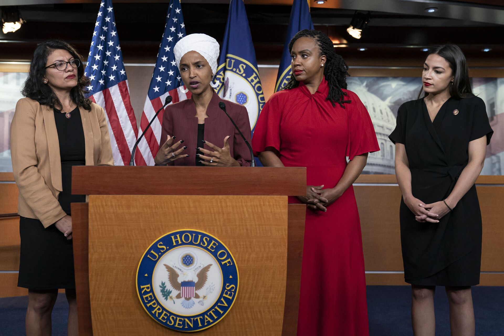 From left, U.S. Reps. Rashida Tlaib, D-Mich., Ilhan Omar, D-Minn., Ayanna Pressley, D-Mass., and Alexandria Ocasio-Cortez, D-N.Y., respond to base remarks by President Donald Trump after he called for four Democratic congresswomen of color to go back to their broken countries, as he exploited the nation's glaring racial divisions once again for political gain, during a news conference at the Capitol in Washington, Monday, July 15, 2019 - Sputnik International, 1920, 07.10.2021