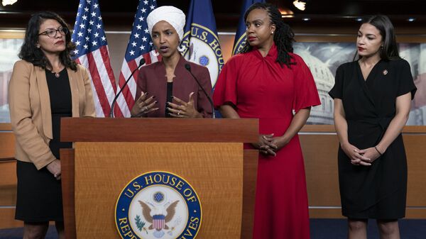 From left, U.S. Reps. Rashida Tlaib, D-Mich., Ilhan Omar, D-Minn., Ayanna Pressley, D-Mass., and Alexandria Ocasio-Cortez, D-N.Y., respond to base remarks by President Donald Trump after he called for four Democratic congresswomen of color to go back to their broken countries, as he exploited the nation's glaring racial divisions once again for political gain, during a news conference at the Capitol in Washington, Monday, July 15, 2019 - Sputnik International