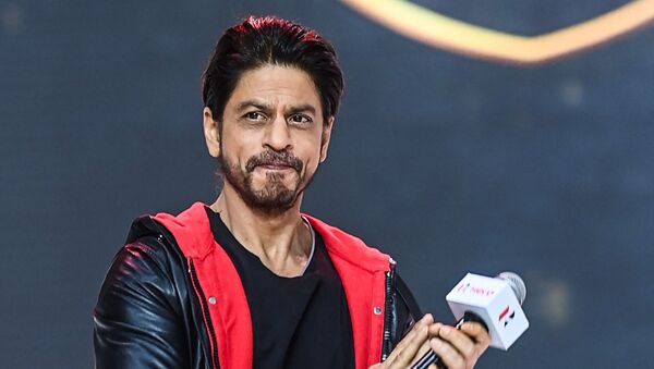 Bollywood actor Shah Rukh Khan gestures as he speaks during the unveiling of the company's 100 millionth motorcycle, in Gurgaon on January 21, 2021 - Sputnik International