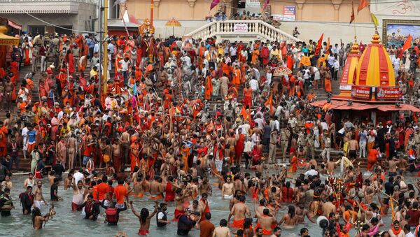  SENSITIVE MATERIAL. THIS IMAGE MAY OFFEND OR DISTURB    Naga Sadhus, or Hindu holy men, take a dip in the Ganges river during the second Shahi Snan at Kumbh Mela, or the Pitcher Festival, amid the spread of the coronavirus disease (COVID-19), in Haridwar, India, April 12, 2021. - Sputnik International