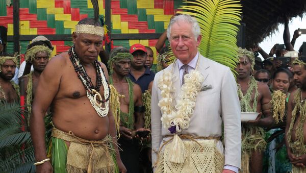 Britain's Prince Charles (R) stands with Chief Seni Mao Tirsupe, the President of the Malvatumauri Council of Chiefs, at the Chief’s Nakamal in Port Vila on April 7, 2018 - Sputnik International