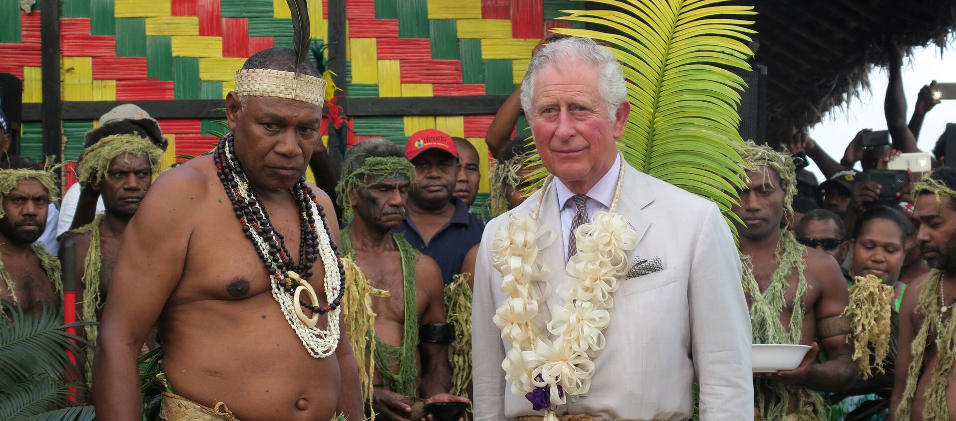 Britain's Prince Charles (R) stands with Chief Seni Mao Tirsupe, the President of the Malvatumauri Council of Chiefs, at the Chief’s Nakamal in Port Vila on April 7, 2018 - Sputnik International, 1920, 13.04.2021