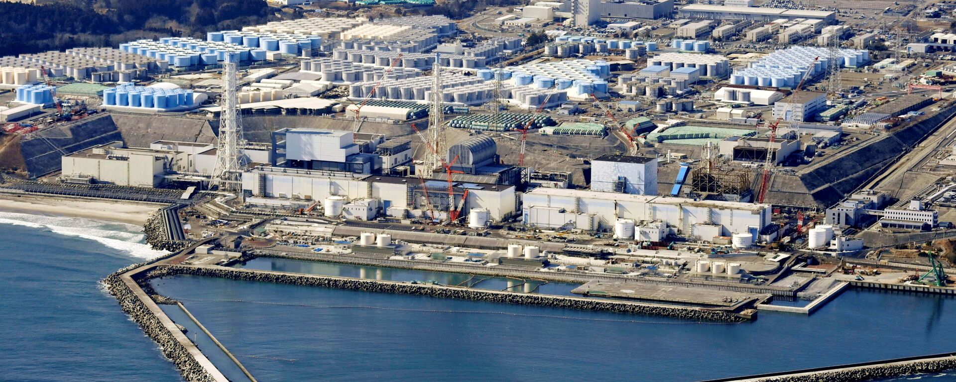 An aerial view shows the storage tanks for treated water at the tsunami-crippled Fukushima Daiichi nuclear power plant in Okuma town, Fukushima prefecture, Japan February 13, 2021, in this photo taken by Kyodo. - Sputnik International, 1920, 13.04.2021