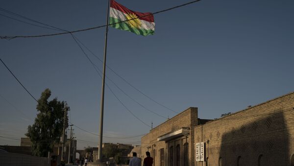 A Kurdish flag waves inside the Irbil's citadel in central Irbil, Iraq, Saturday, Oct. 21, 2017. - Sputnik International