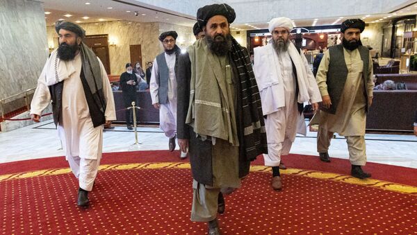 Mullah Abdul Ghani Baradar, the Taliban's deputy leader and negotiator, and other delegation members attend the Afghan peace conference in Moscow, Russia, 18 March 2021. - Sputnik International