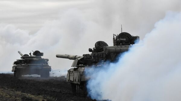 Tanks of the Ukrainian Armed Forces are seen during drills at an unknown location near the border of Crimea, Russia, in this handout picture released by the General Staff of the Armed Forces of Ukraine press service on 14 April 2021. - Sputnik International