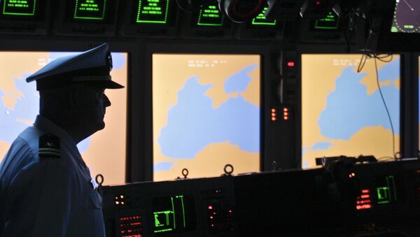 In this Tuesday, June 7, 2011 file photo, a US Navy officer, name not available, stands on the weapons control deck of the USS Monterey as screens display the Black Sea region, in the Black Sea port of Constanta, Romania. - Sputnik International