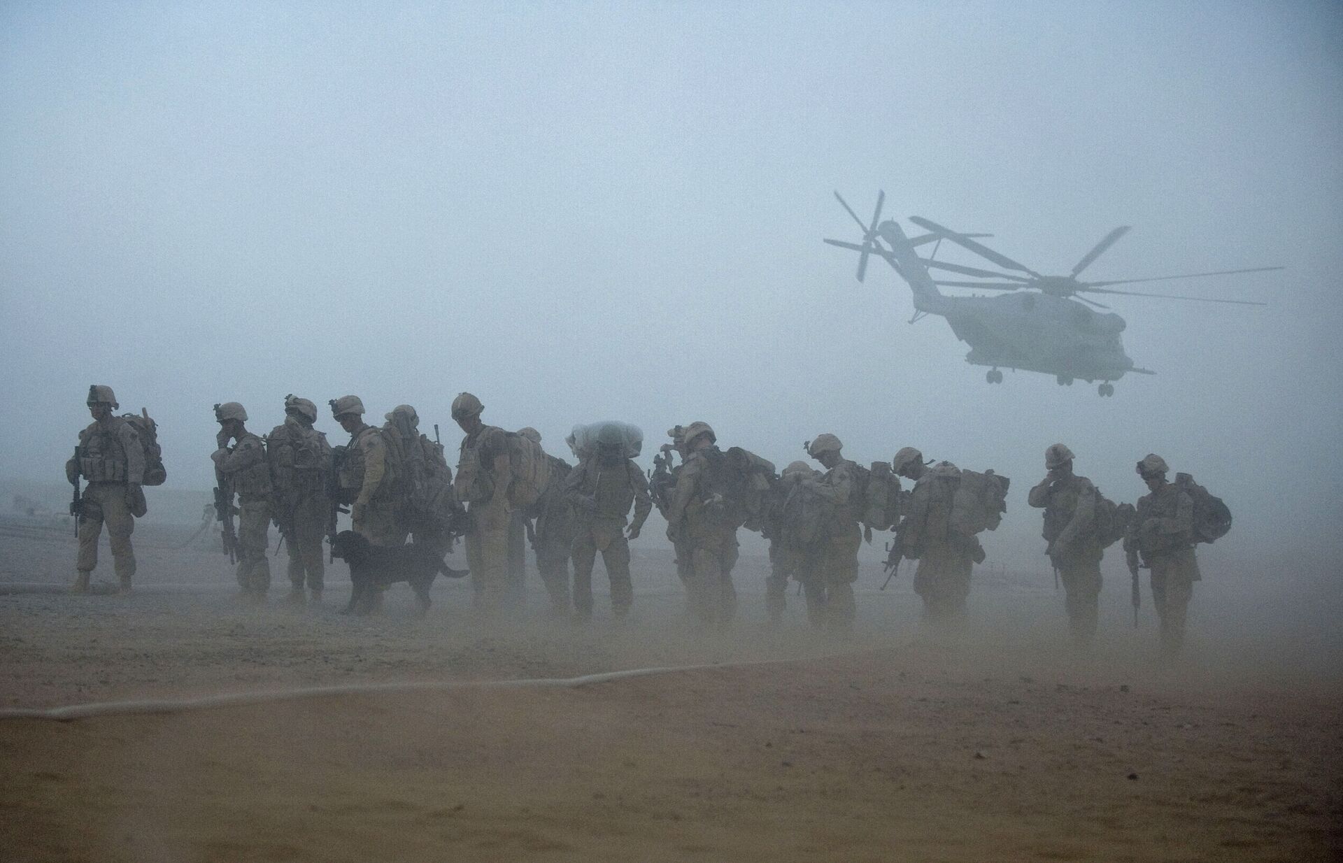 In this file photo US Marines from the 2nd Battalion, 8th Marine Regiment of the 2nd Marine Expeditionary Brigade wait for helicopter transport as part of Operation Khanjar at Camp Dwyer in Helmand Province in Afghanistan on July 2, 2009. - Sputnik International, 1920, 07.09.2021