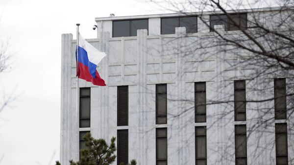 The Russian flag flies over the Russian embassy in Washington, Saturday, March 1, 2014 - Sputnik International