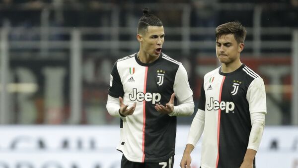 Juventus' Cristiano Ronaldo, left, speaks with Juventus' Paulo Dybala at the end of the Italian Cup soccer match between AC Milan and Juventus at the San Siro stadium, in Milan, Italy, Thursday, 13 February 2020 - Sputnik International