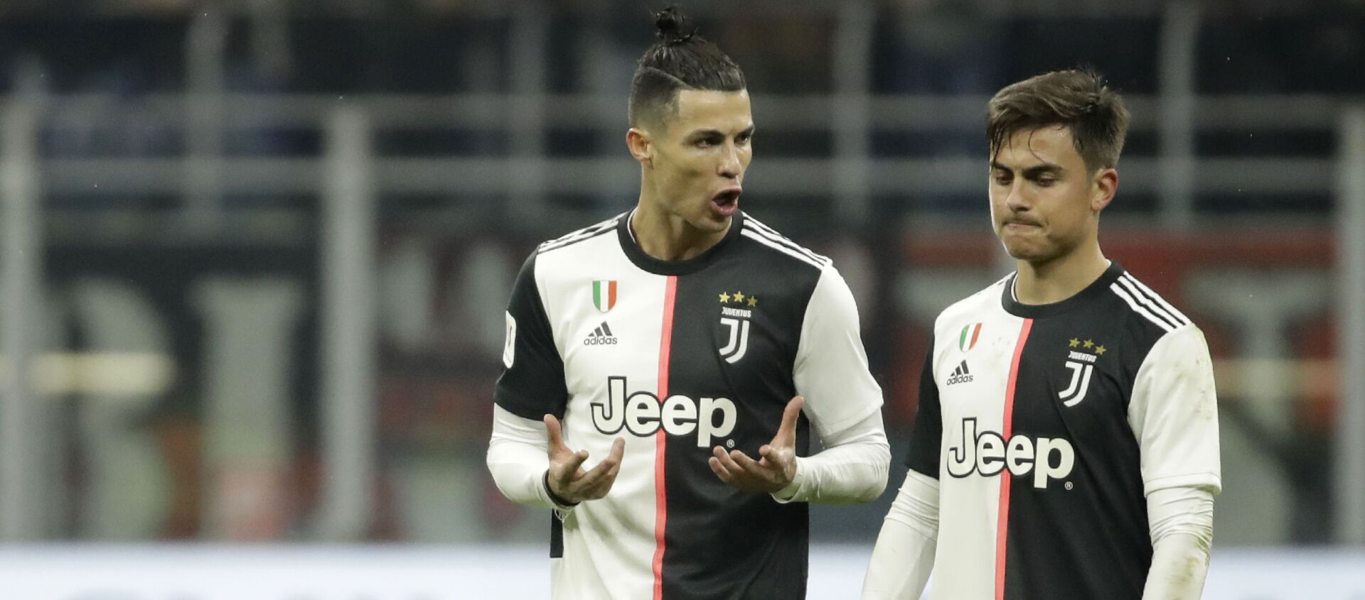 Juventus' Cristiano Ronaldo, left, speaks with Juventus' Paulo Dybala at the end of the Italian Cup soccer match between AC Milan and Juventus at the San Siro stadium, in Milan, Italy, Thursday, 13 February 2020 - Sputnik International, 1920, 15.04.2021