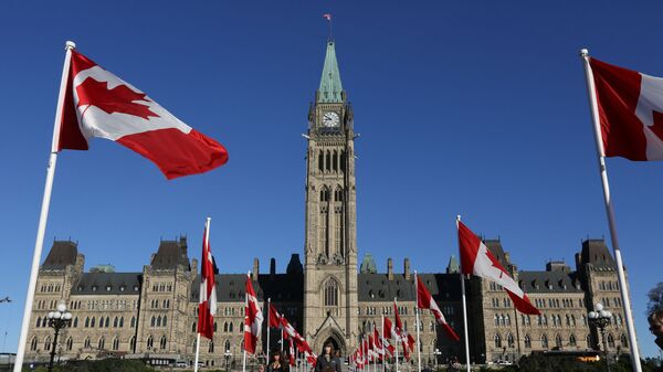 Canadian flags line the walkway in front of the Parliament in Ottawa, Ontario, October 2, 2017 - Sputnik International