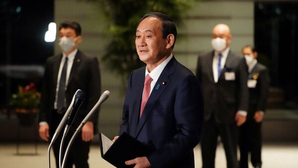 Japanese Prime Minister Yoshihide Suga speaks to media after announcing that Tokyo, Kyoto and Okinawa will have pre-emergency status under a new prevention law during a government task force meeting at the prime minister's office, Tokyo, Japan, April 9, 2021. - Sputnik International
