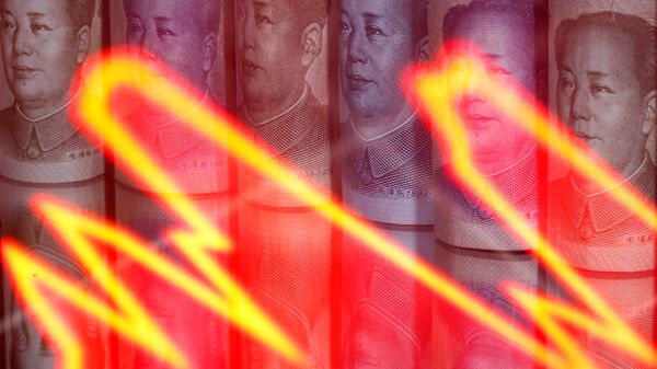 Chinese yuan banknotes are seen behind illuminated stock graph in this illustration taken February 10, 2020 - Sputnik International
