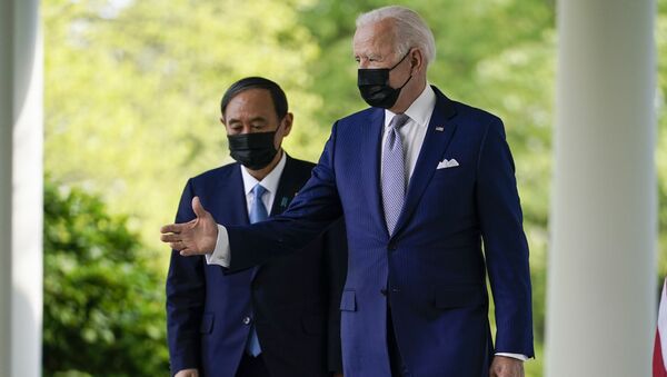 President Joe Biden, accompanied by Japanese Prime Minister Yoshihide Suga, walks from the Oval Office to speak at a news conference in the Rose Garden of the White House, Friday, April 16, 2021, in Washington. - Sputnik International
