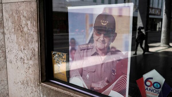 A picture of former Cuban President Raul Castro is displayed in the window of a state building in Havana, Cuba, April 11, 2021. Picture taken April 11, 2021. - Sputnik International