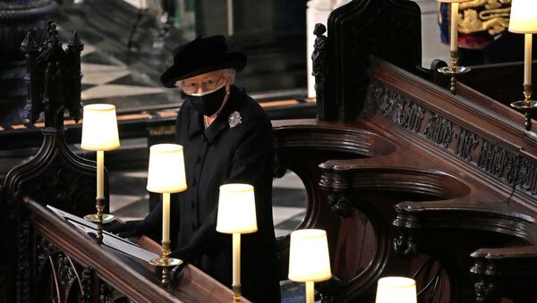 Britain's Queen Elizabeth is seen during the funeral of Britain's Prince Philip, husband of Queen Elizabeth, who died at the age of 99, at St George's Chapel, in Windsor, Britain, April 17, 2021. Yui Mok/Pool via REUTERS     TPX IMAGES OF THE DAY - Sputnik International