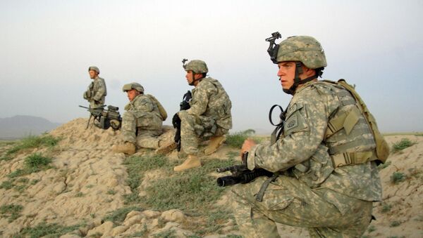U.S Army Soldiers from Alpha Company, 2nd Battalion, 508th Parachute Infantry Regiment move into position to support Afghan National police who are moving in to apprehend a suspect during a cordon and search of Pana, Afghanistan, June 9, 2007 - Sputnik International